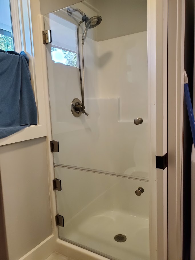 This dog shower has two doors! One on top of the other to allow the owner to bathe their dog with the bottom door closed. How fun!