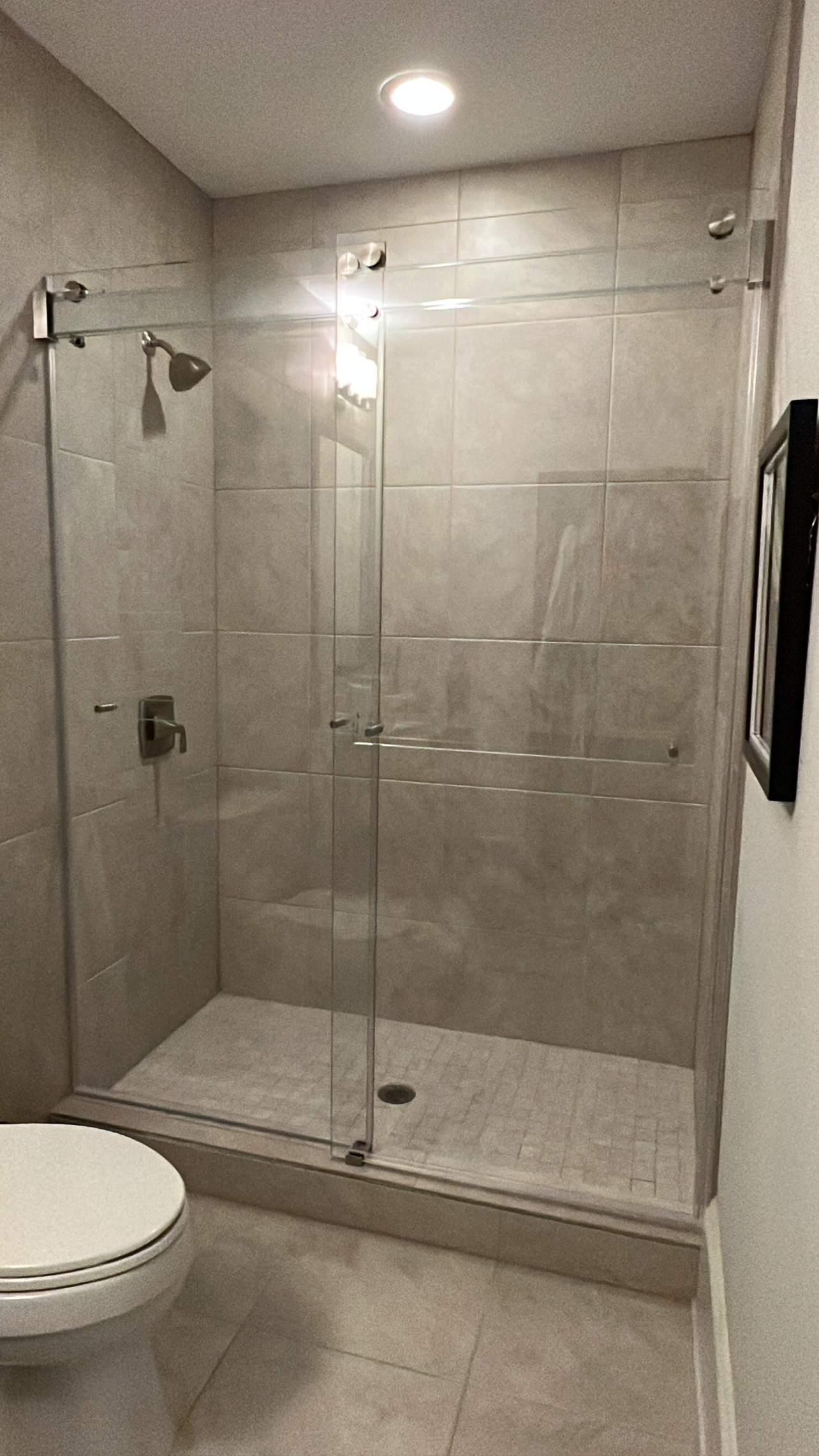 The glass towel bar on this bypassing Phantom slider completes the look for the most frameless and strongest possible shower enclosure.