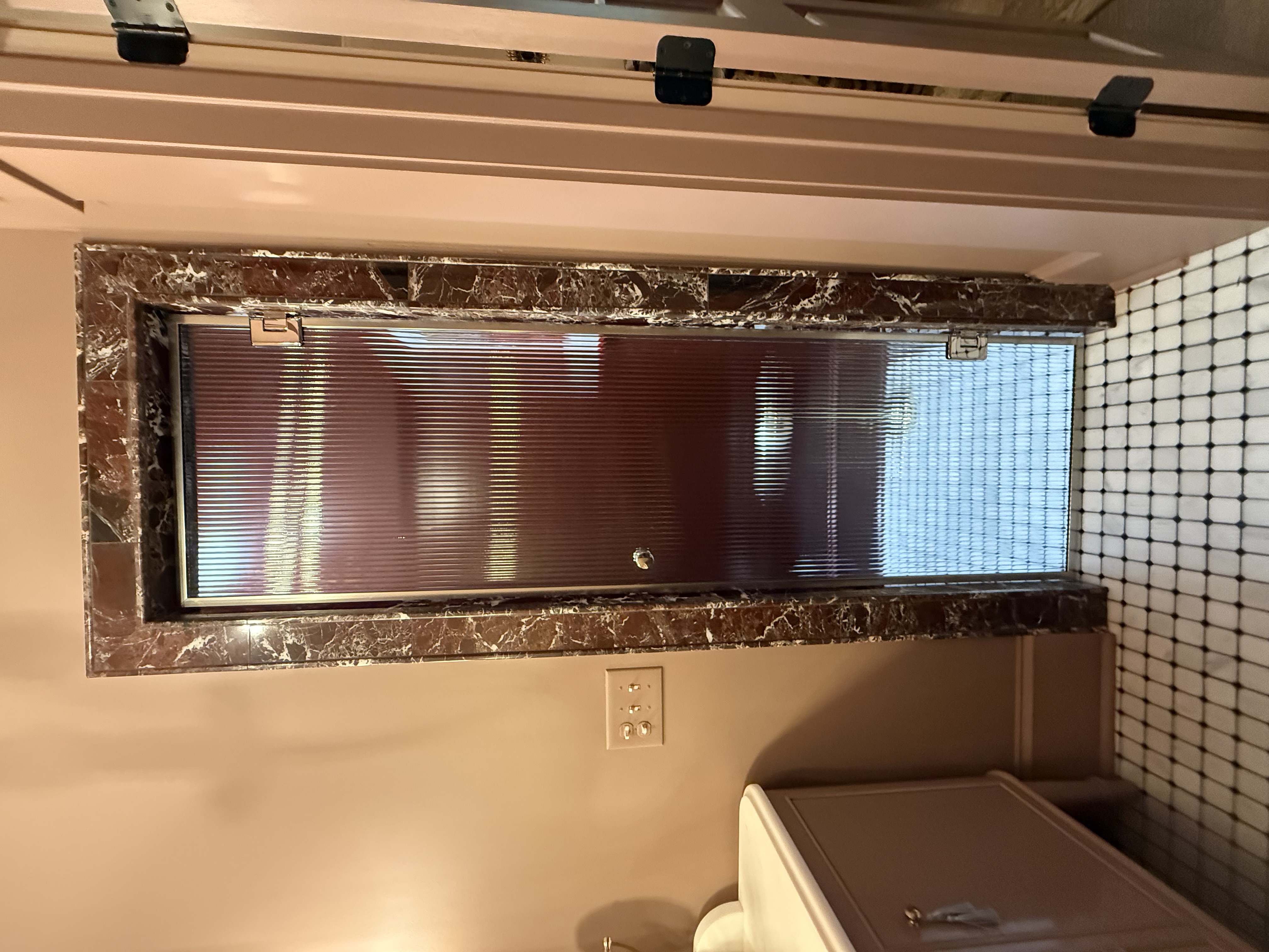 This is another reeded glass enclosure from Emily Lambert Designs which includes polished nickel hardware and a polished nickel knob.