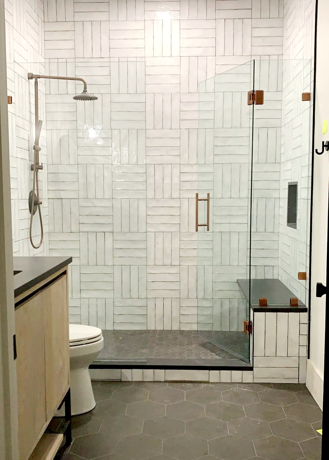 If you're wondering what color hardware is on this stunning inline shower, it is called Antique Brushed Copper from CR Laurence! You can find this and more on our Customize page.