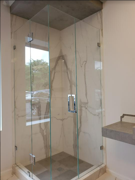 This corner door was created with UV glue! Come see it in person at the ArMex Stone showroom in Buford!