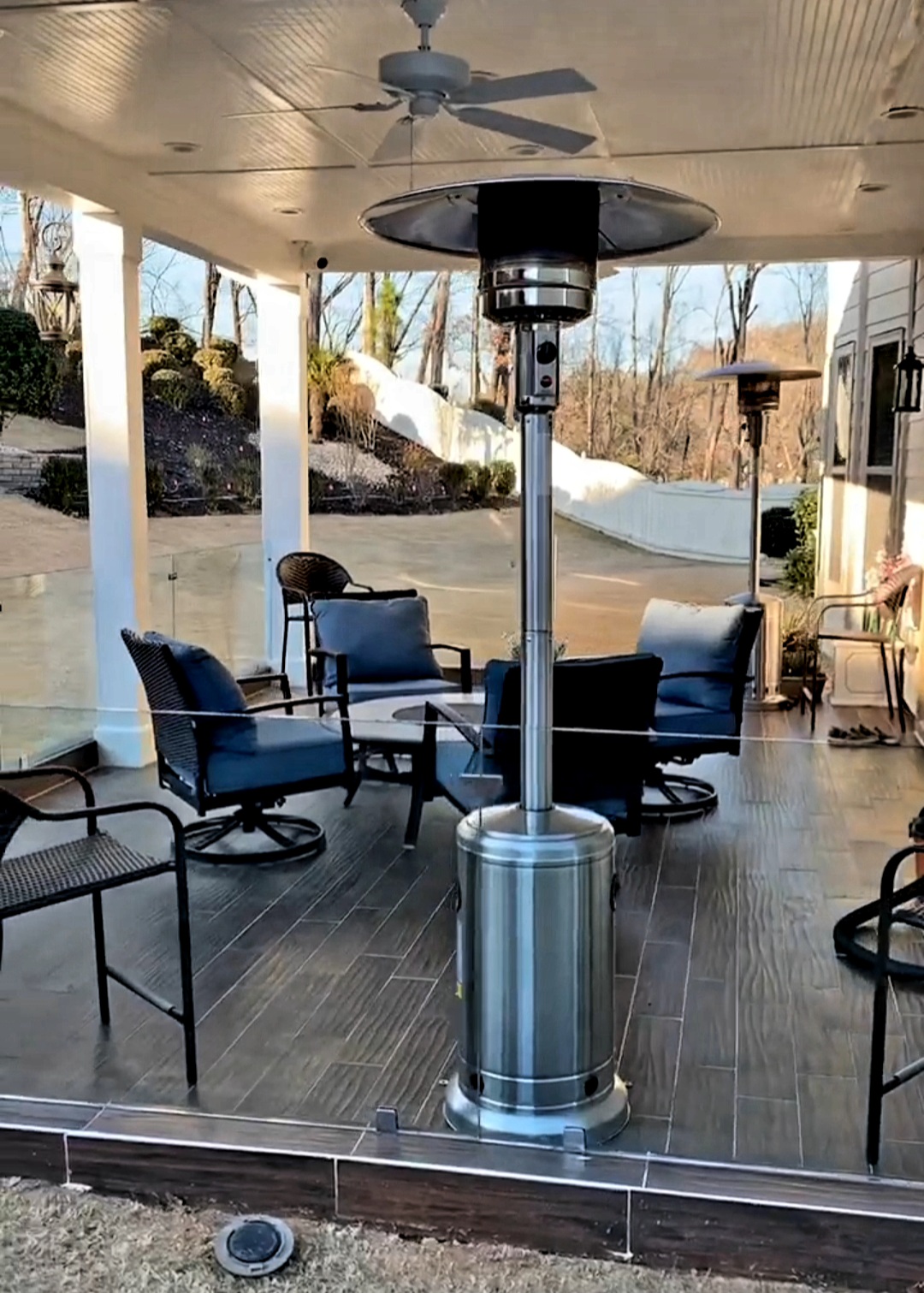 This back patio features wind screens to keep it breezy but not too breezy! Frameless glass railings are mounted on all three sides with heavy duty clamps and standoffs.