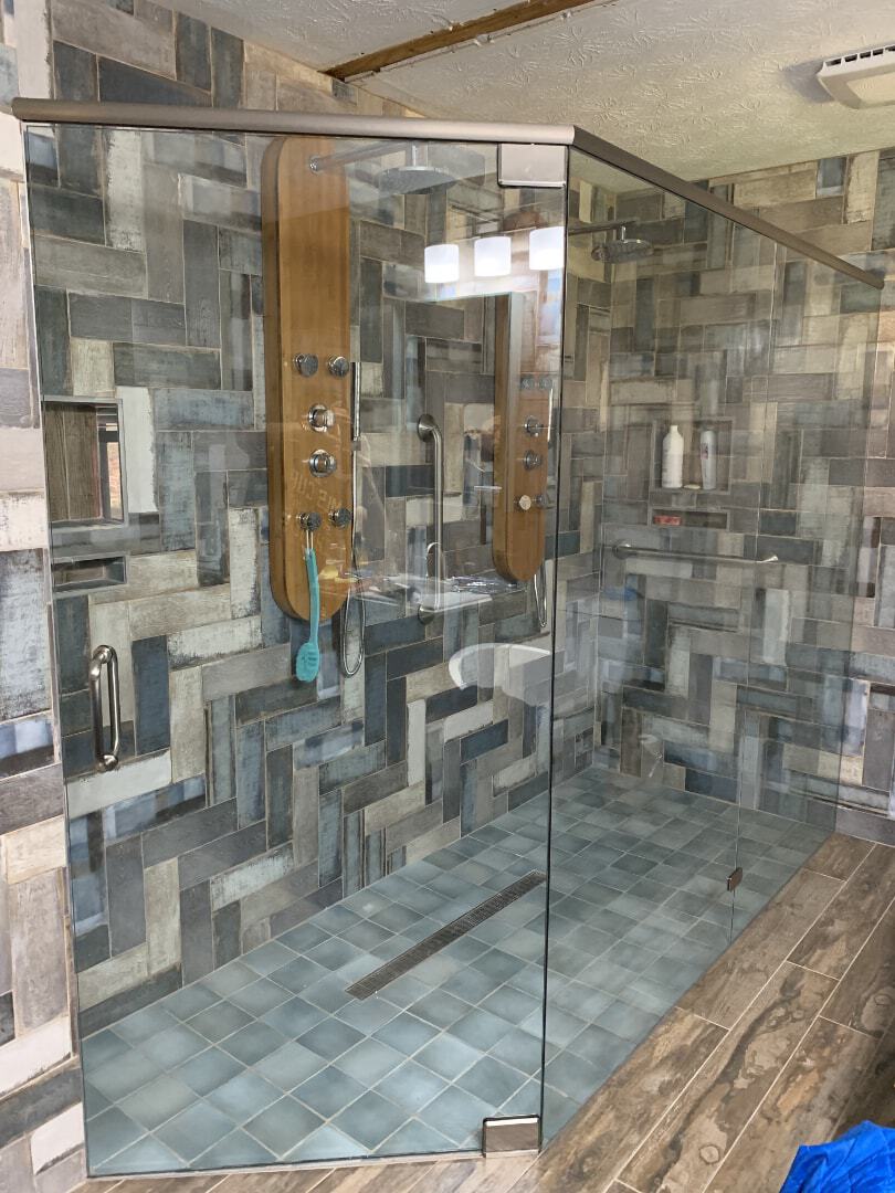 This is a handicap shower enclosure with an oversized door at approximately 36" wide requiring a heavy duty pivot hinge.